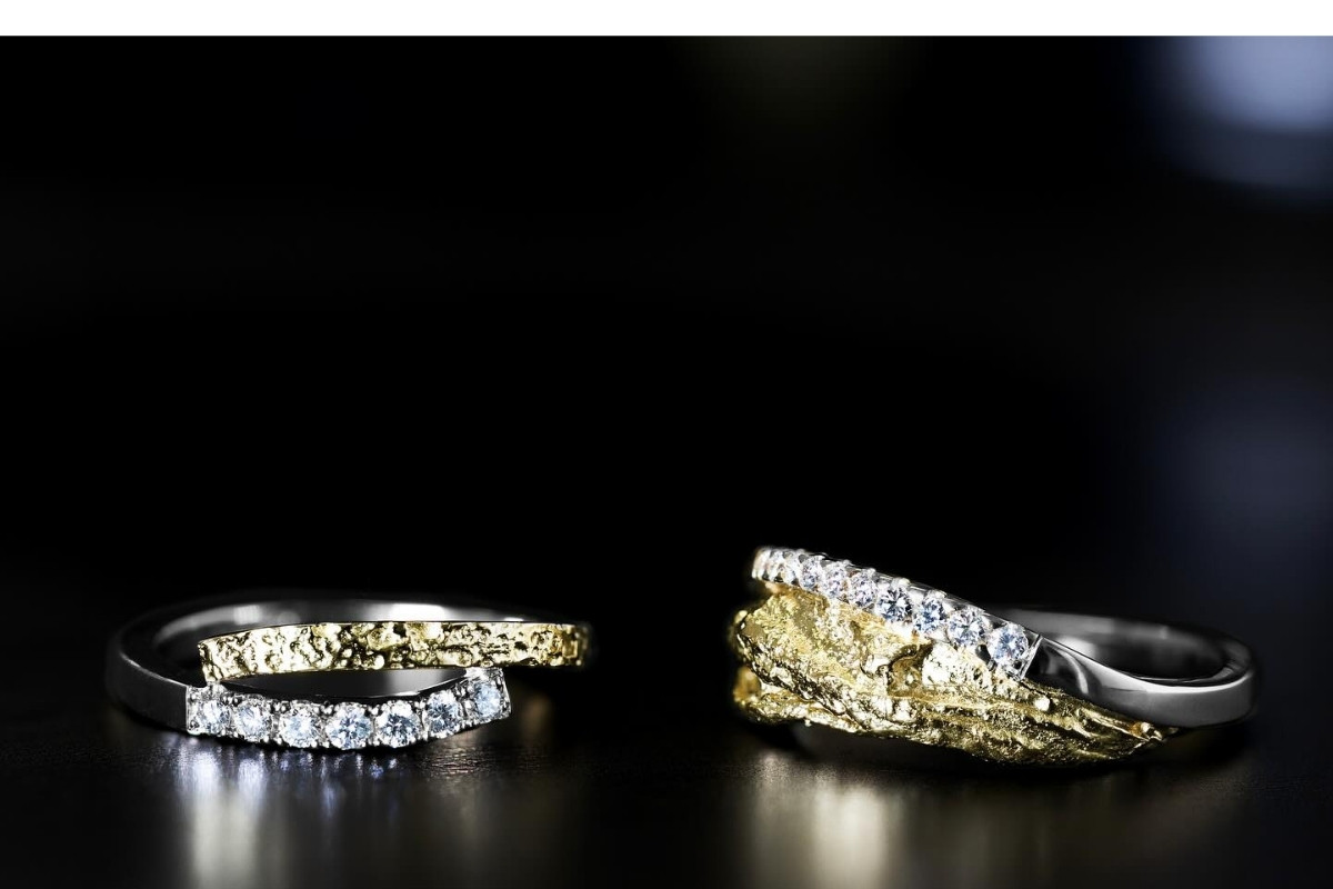 A display of unique gold rings adorned with diamonds, available at Prakt Jewellery.