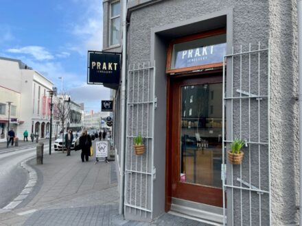 The storefront of Prakt Jewellery located in Reykjavik, Iceland, with its signage visible.