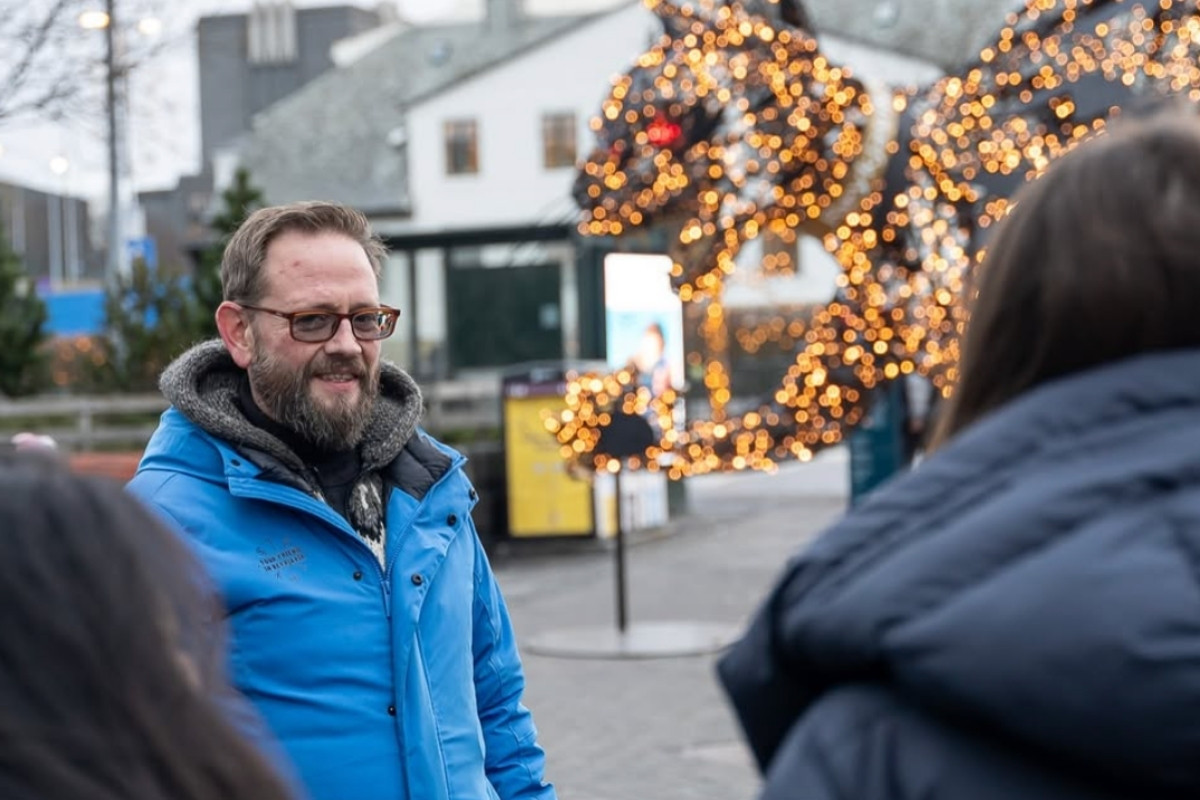 An individual wearing a blue jacket with 