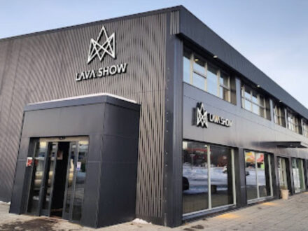 A wide shot of the Lava Show venue, a contemporary building with signage clearly displaying the attraction's name and logo.