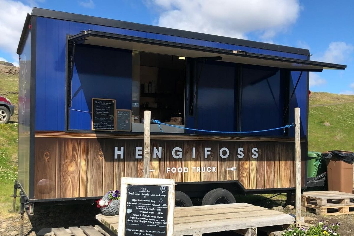 Hengifoss food truck with open window and menu.