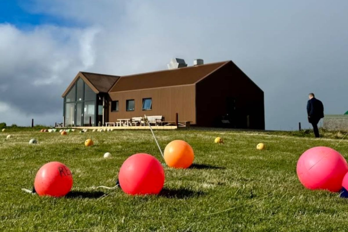 Kaffi Gola building on a grassy hill.