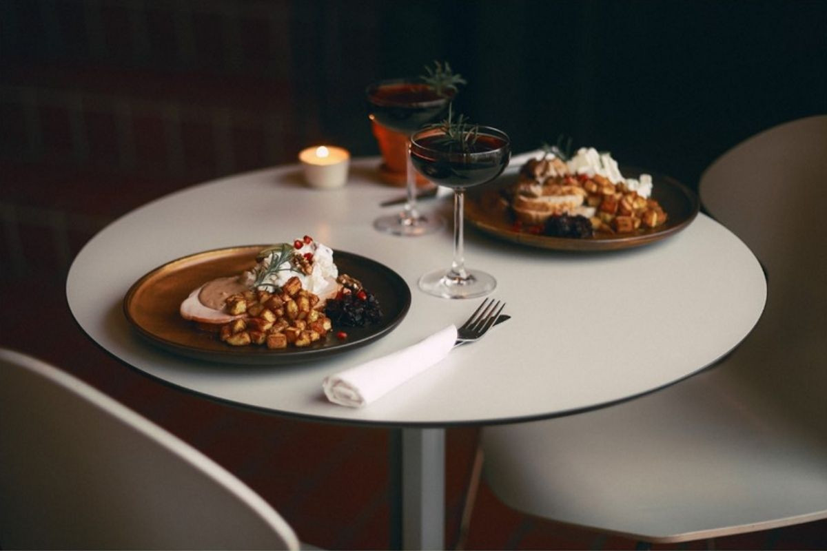 A table set for two with food and drinks in a at Ketilkaffi.